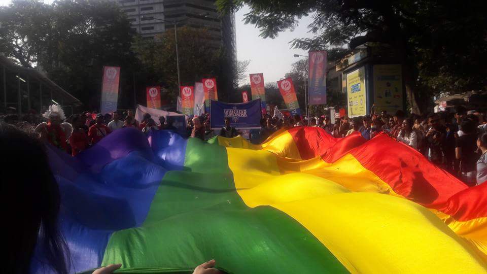 In the global tradition of Prides, a giant rainbow flag was unfurled and people danced under and around it.