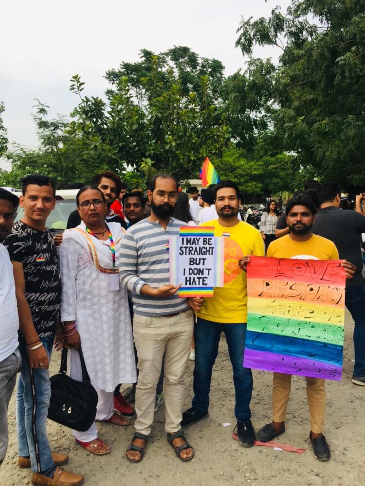 people holding banner at Amristar LGBTQ Pride