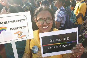 woman holding pride poster